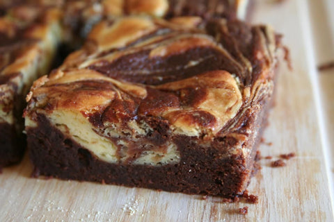 Free with $10 purchase! Uncle Bob's Brownie Mix with directions for cheesecake brownies. Limit 1